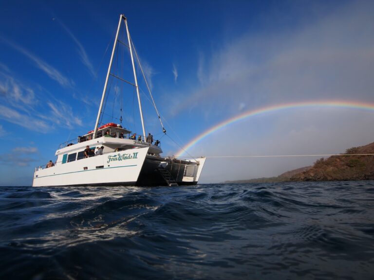 A rainbow rests on the deck of the Four Winds in Maui, Hawaii